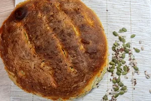 Pâine de casă pufoasă cu semințe de in. Secretul pentru a obține coaja crocantă și miezul pufos
